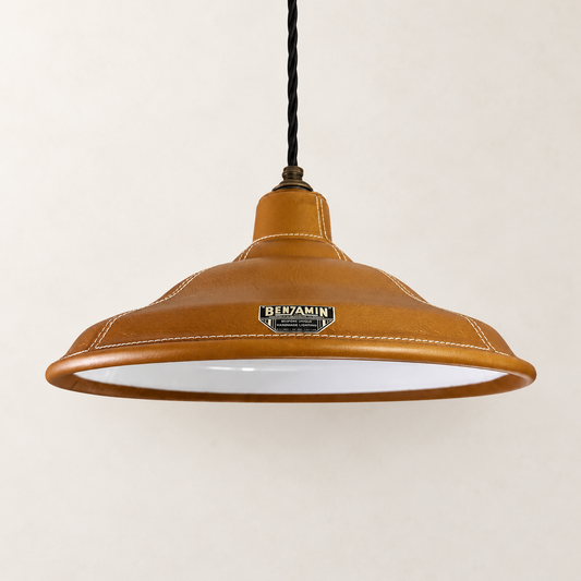 Bawsey Tan Leather Effect Industrial Pendant Light showing tan leather-effect shade front view on a warm off-white studio background