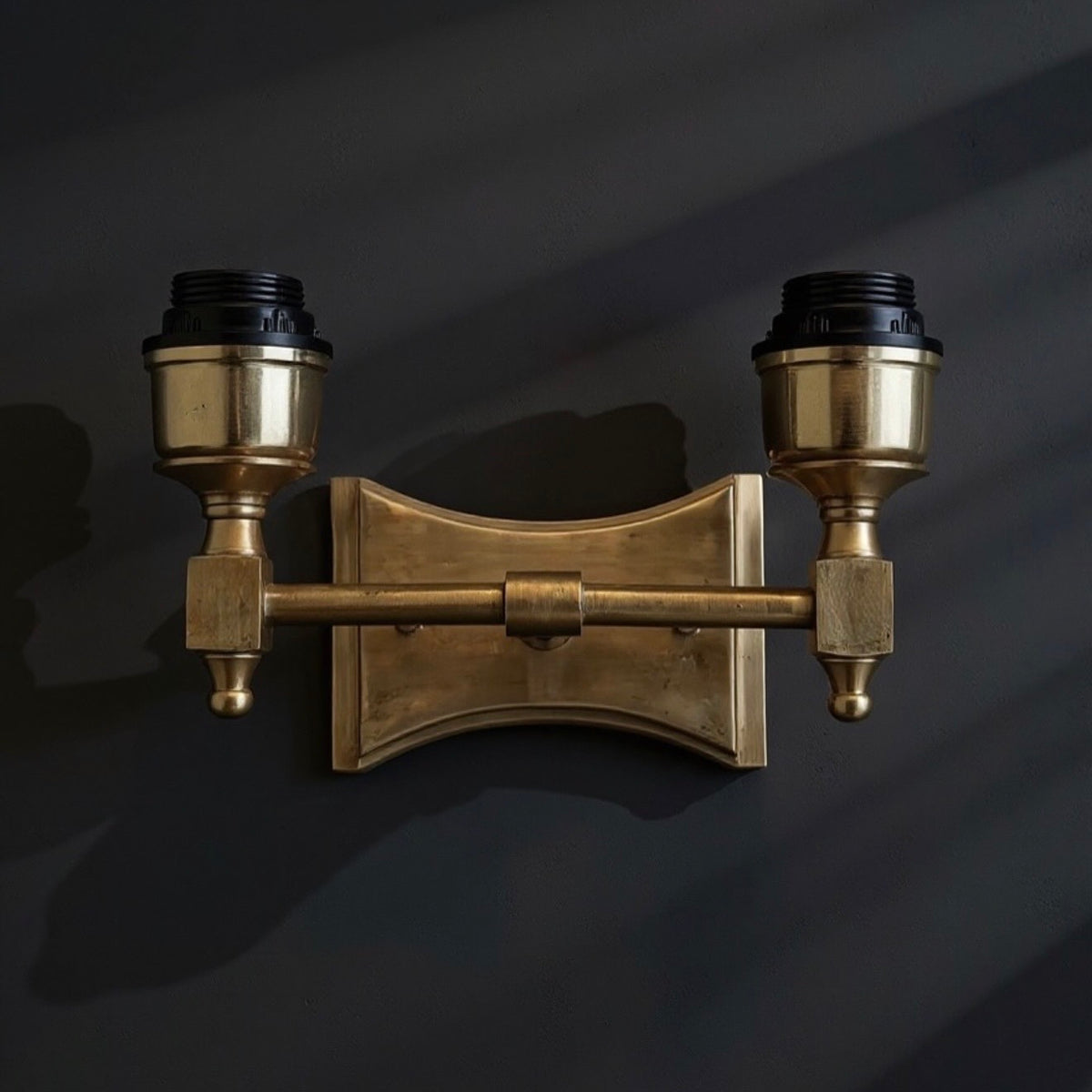 Brass wall light. Dark scenery