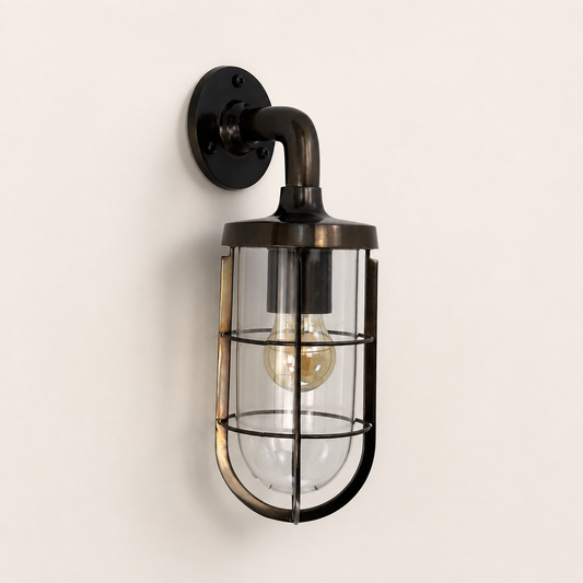 Runton antique brass caged swan-neck wall light with clear glass shade and Edison bulb